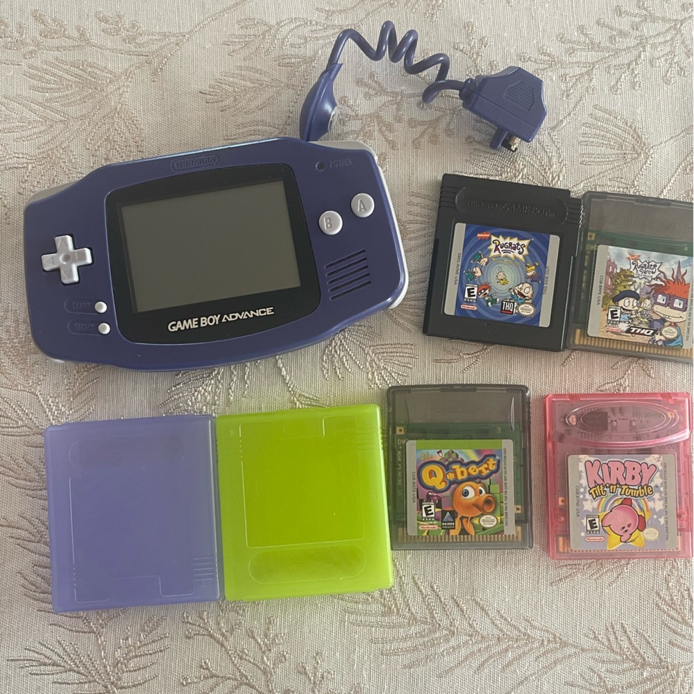 Game Boy Advance w/ light attachment, and games.